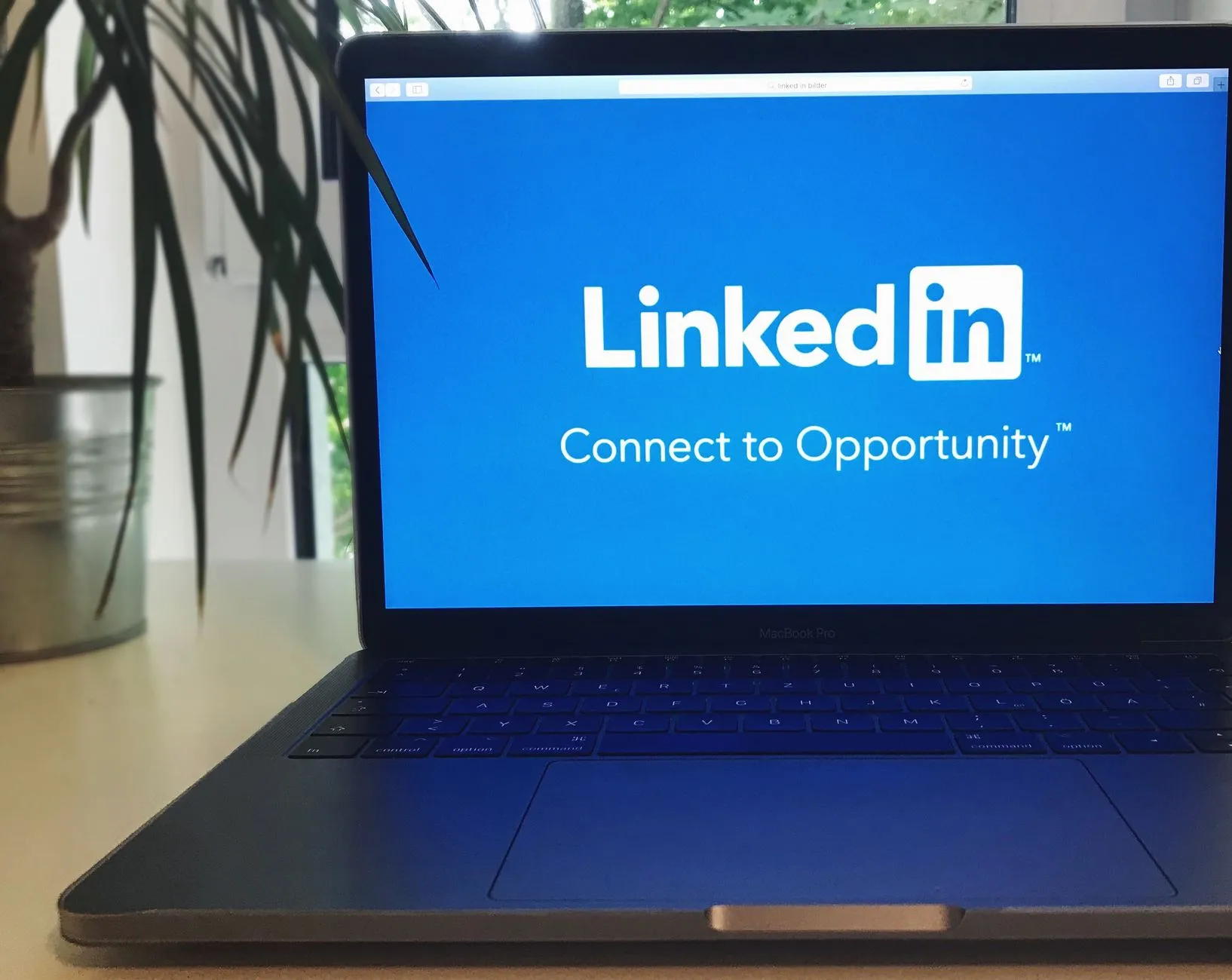 Laptop open to LinkedIn, used for outreach from the Chrome extension