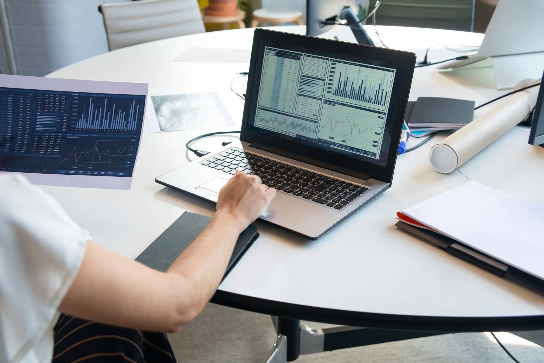 Person reviewing prospect data charts on a laptop screen